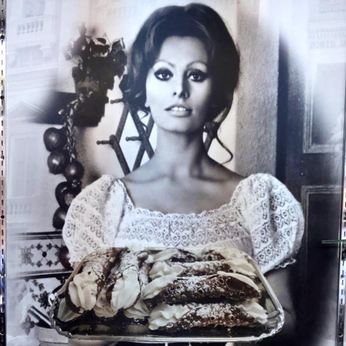 Photo of a famous Italian Actress Sofia Holding Cannolis